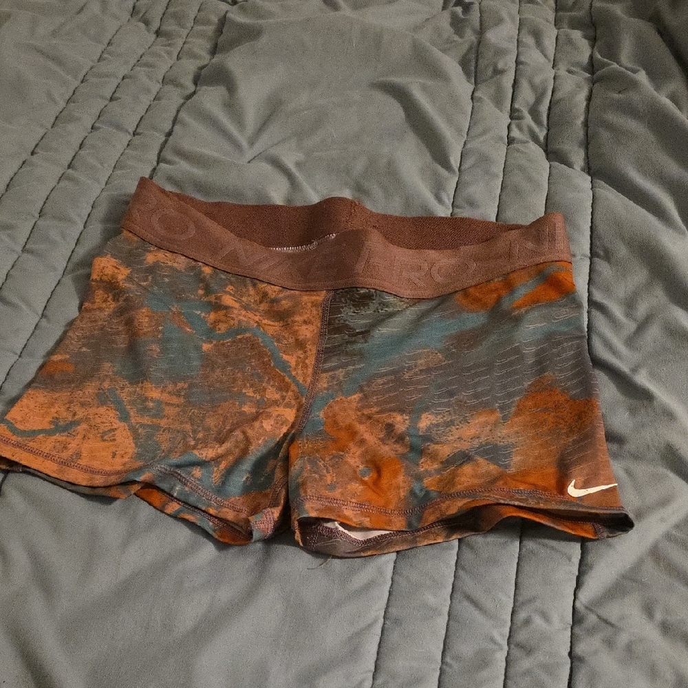 Nike Orange and Brown Athletic Shorts with Modern Design